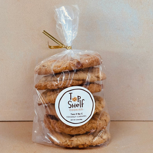 Packaged cookies with a 'Top Shelf' label on a beige background